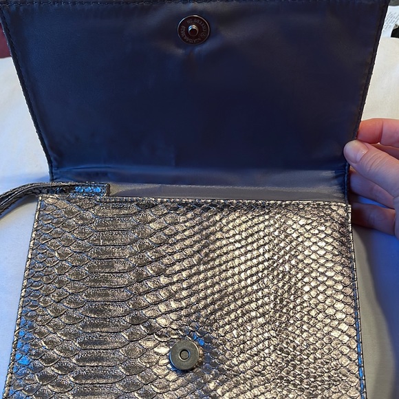Neiman Marcus wristlet. Silver. Shine pulls bronze or gray depending. 9.5”x5.5” - Picture 3 of 8